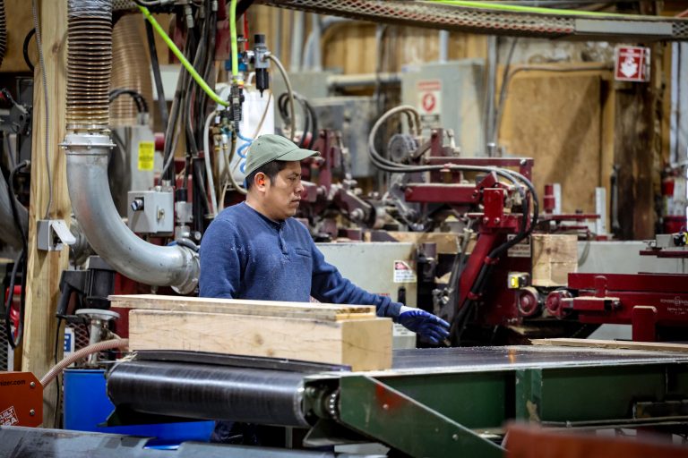 Worker assembling pallets